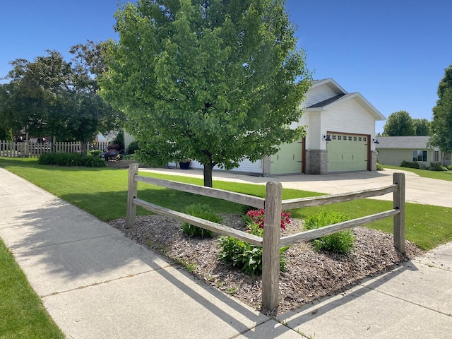 431 Limestone St, Kiel, WI 53042 - view of front of house with driveway, a garage, and brick siding