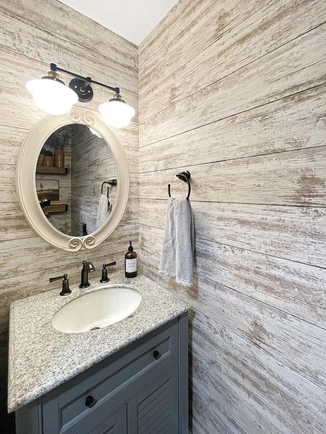 431 Limestone St, Kiel, WI 53042 - bathroom featuring vanity and wooden walls