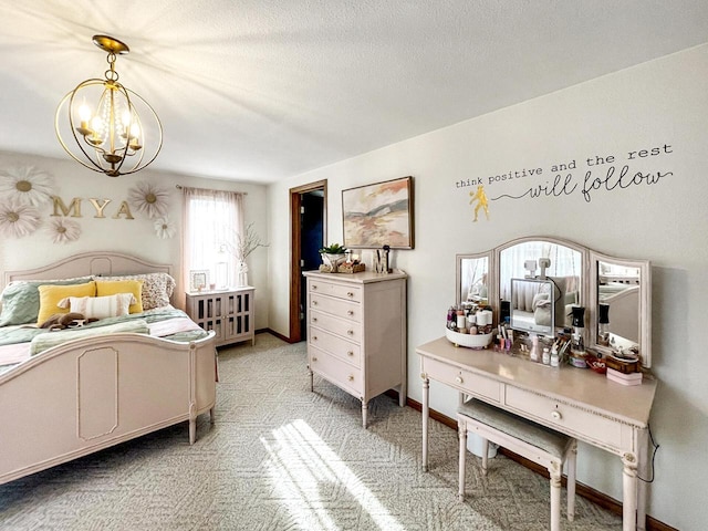 431 Limestone St, Kiel, WI 53042 - bedroom with a chandelier, light carpet, and a textured ceiling