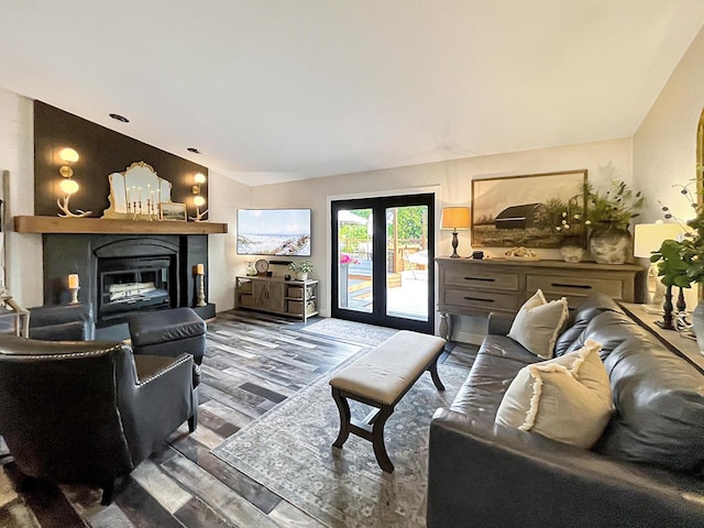 431 Limestone St, Kiel, WI 53042 - living room featuring a glass covered fireplace and wood finished floors