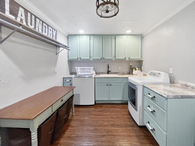 431 Limestone St, Kiel, WI 53042 - washroom with washer and dryer, crown molding, and dark wood-style flooring