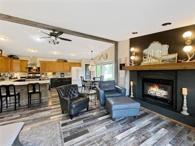 431 Limestone St, Kiel, WI 53042 - living room featuring wood finished floors, a glass covered fireplace, and ceiling fan