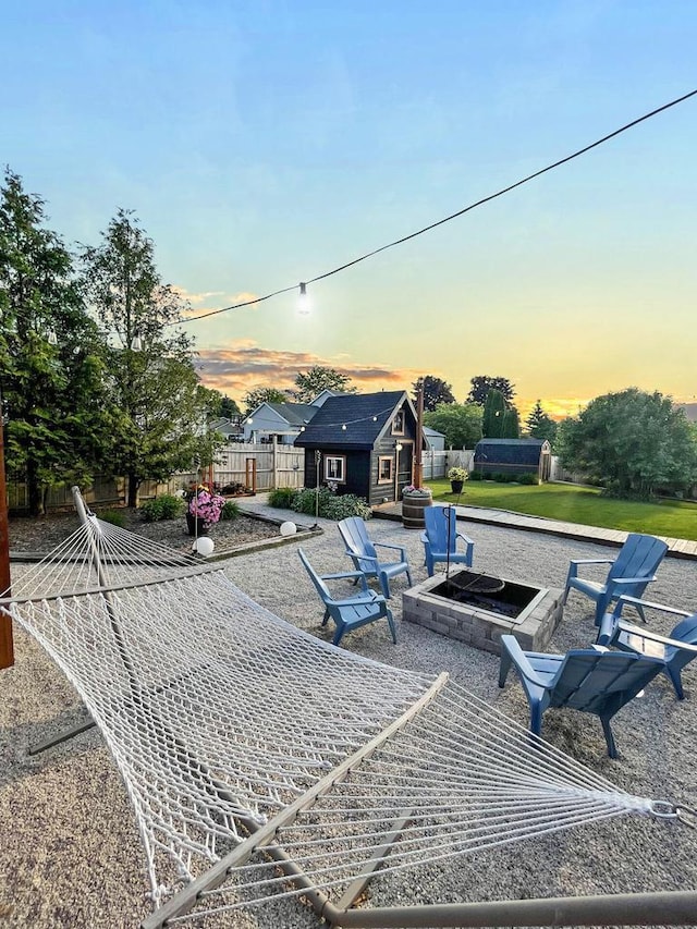 431 Limestone St, Kiel, WI 53042 - view of front facade featuring an outdoor fire pit, a shed, and a patio