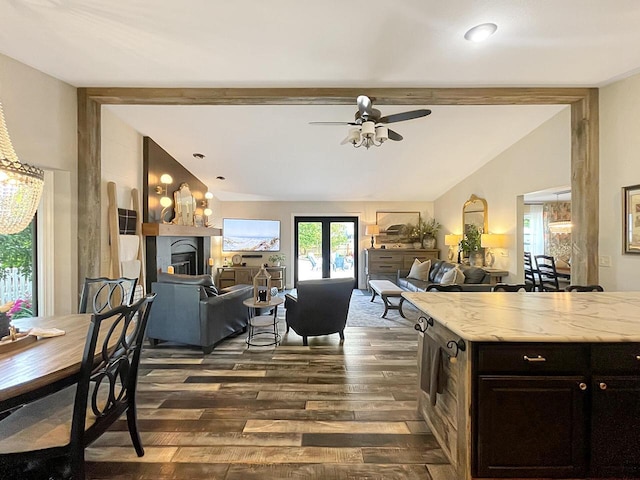 431 Limestone St, Kiel, WI 53042 - kitchen with dark wood-style flooring, ceiling fan, open floor plan, a fireplace, and light stone countertops