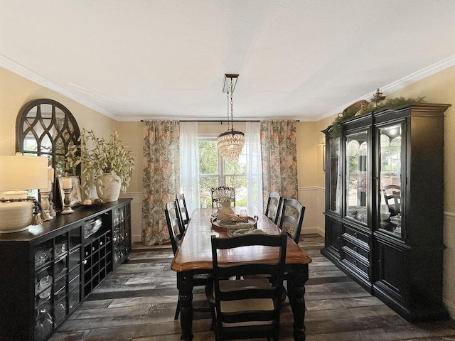 431 Limestone St, Kiel, WI 53042 - dining area featuring dark wood finished floors, wainscoting, and ornamental molding