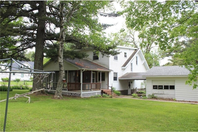 514 S Robert St, Grantsburg, WI 54840 - back of property with an attached garage, a yard, and a shingled roof