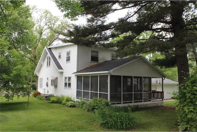 514 S Robert St, Grantsburg, WI 54840 - back of property with a sunroom and a yard