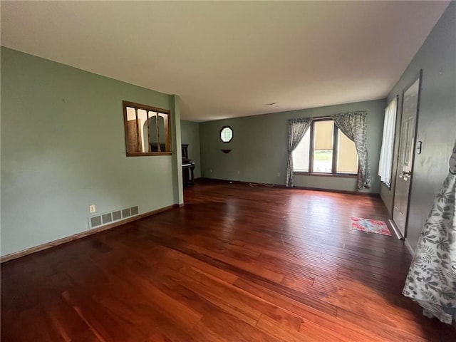 514 S Robert St, Grantsburg, WI 54840 - empty room featuring wood finished floors and baseboards