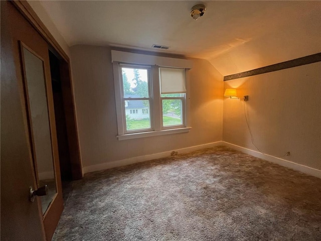 514 S Robert St, Grantsburg, WI 54840 - unfurnished bedroom featuring vaulted ceiling and carpet flooring