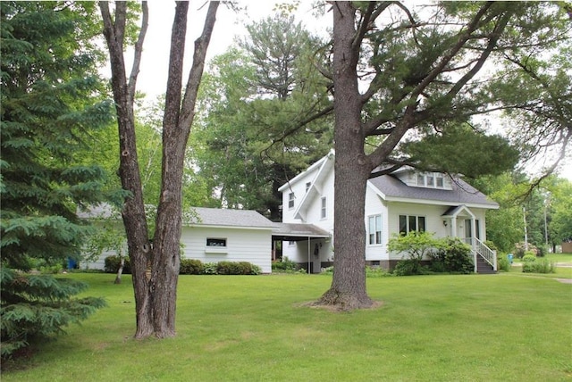 514 S Robert St, Grantsburg, WI 54840 - view of front facade with a front yard