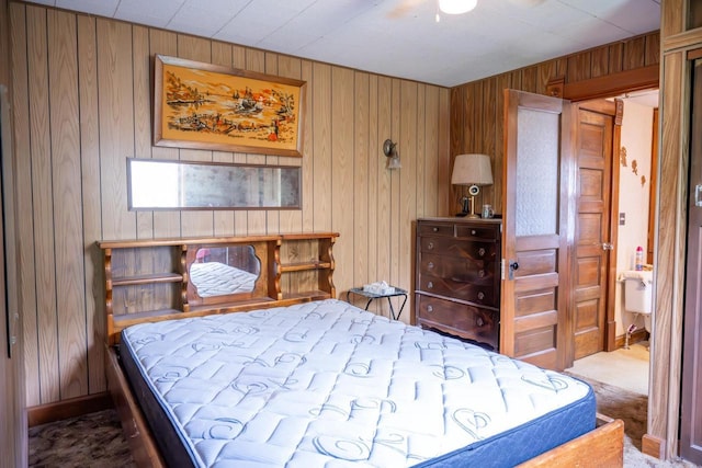 318 Tremont St, Mauston, WI 53948 - bedroom featuring wooden walls and carpet floors