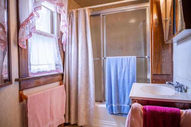 318 Tremont St, Mauston, WI 53948 - full bathroom with vanity and enclosed tub / shower combo