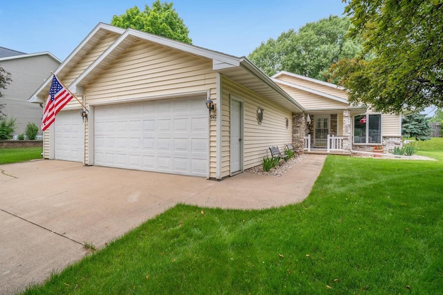 942 E Mayfield Dr, Appleton, WI 54911 - view of front of property featuring an attached garage, a front yard, covered porch, and concrete driveway