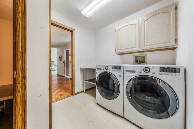 942 E Mayfield Dr, Appleton, WI 54911 - laundry area featuring cabinet space, washing machine and dryer, and light flooring