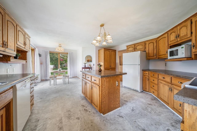 942 E Mayfield Dr, Appleton, WI 54911 - kitchen featuring white appliances, a chandelier, dark countertops, a center island, and brown cabinetry
