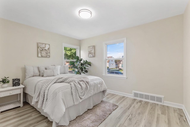 3700 S 21st St, Milwaukee, WI 53221 - bedroom with light wood-style flooring and baseboards