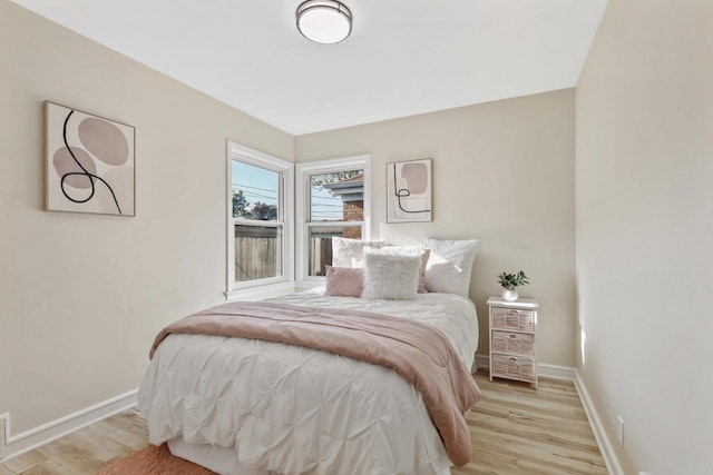 3700 S 21st St, Milwaukee, WI 53221 - bedroom featuring light wood-type flooring and baseboards