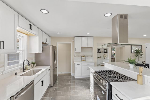 3700 S 21st St, Milwaukee, WI 53221 - kitchen featuring appliances with stainless steel finishes, island range hood, recessed lighting, light countertops, and white cabinets
