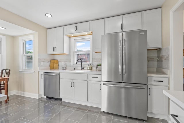 3700 S 21st St, Milwaukee, WI 53221 - kitchen featuring stainless steel appliances, light countertops, white cabinetry, plenty of natural light, and recessed lighting