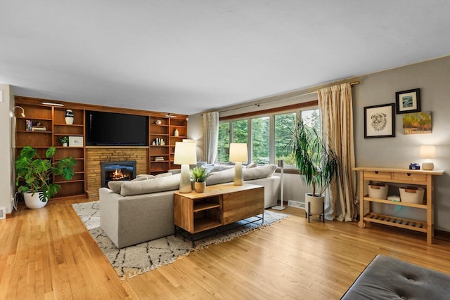 5706 Tolman Ter, Madison, WI 53711 - living room with wood finished floors and a glass covered fireplace