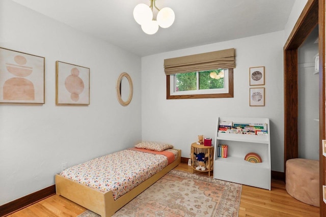 5706 Tolman Ter, Madison, WI 53711 - bedroom featuring a chandelier and wood finished floors