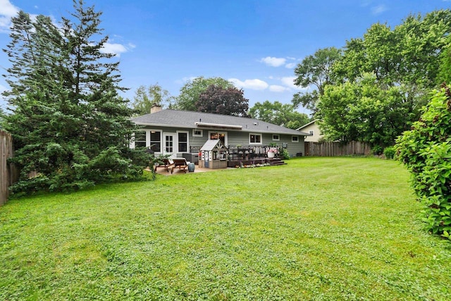 5706 Tolman Ter, Madison, WI 53711 - rear view of house featuring a fenced backyard, a chimney, a wooden deck, and a patio area