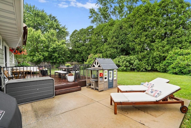 5706 Tolman Ter, Madison, WI 53711 - view of patio featuring outdoor dining space, a storage shed, view of wooded area, and a deck