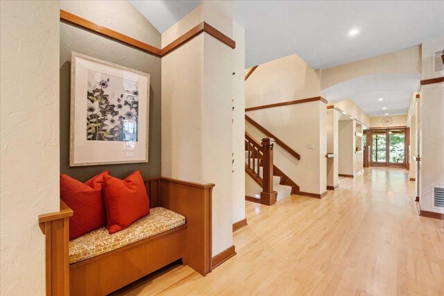 5870 Persimmon Dr, Fitchburg, WI 53711 - corridor featuring arched walkways, wood finished floors, stairway, and recessed lighting