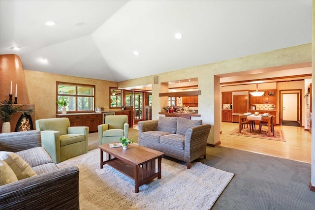 5870 Persimmon Dr, Fitchburg, WI 53711 - living room with lofted ceiling, carpet flooring, and recessed lighting