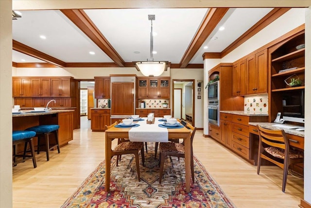 5870 Persimmon Dr, Fitchburg, WI 53711 - dining space featuring beam ceiling, light wood-style floors, ornamental molding, and recessed lighting