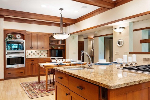 5870 Persimmon Dr, Fitchburg, WI 53711 - kitchen featuring oven, open shelves, brown cabinetry, pendant lighting, and light wood finished floors