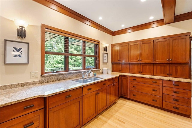 5870 Persimmon Dr, Fitchburg, WI 53711 - kitchen with brown cabinets, light stone counters, and light wood-style floors