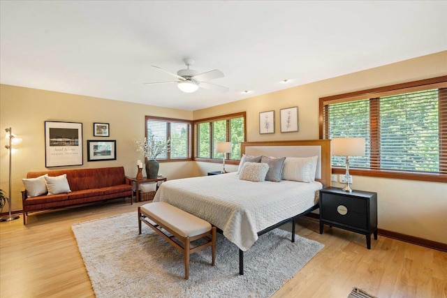 5870 Persimmon Dr, Fitchburg, WI 53711 - bedroom with light wood-type flooring and ceiling fan