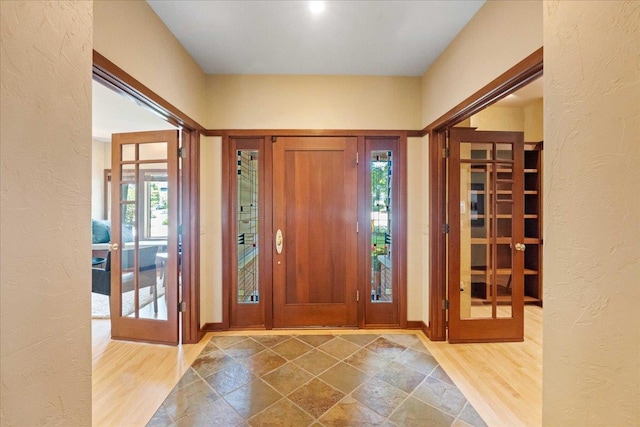 5870 Persimmon Dr, Fitchburg, WI 53711 - foyer entrance with a textured wall and wood finished floors
