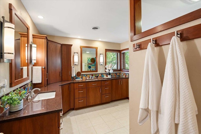 5870 Persimmon Dr, Fitchburg, WI 53711 - full bathroom featuring two vanities and recessed lighting