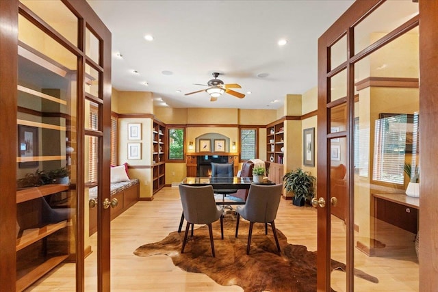 5870 Persimmon Dr, Fitchburg, WI 53711 - dining room featuring french doors, light wood-style floors, ceiling fan, recessed lighting, and a desk