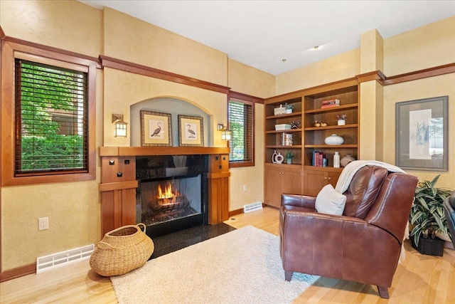 5870 Persimmon Dr, Fitchburg, WI 53711 - living area with wood finished floors and a fireplace with flush hearth