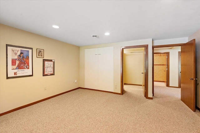 5870 Persimmon Dr, Fitchburg, WI 53711 - unfurnished bedroom featuring light colored carpet and recessed lighting