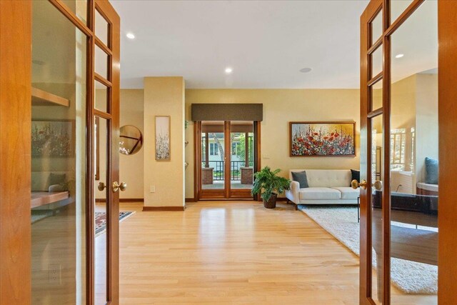 5870 Persimmon Dr, Fitchburg, WI 53711 - entryway with french doors, light wood-style flooring, and recessed lighting