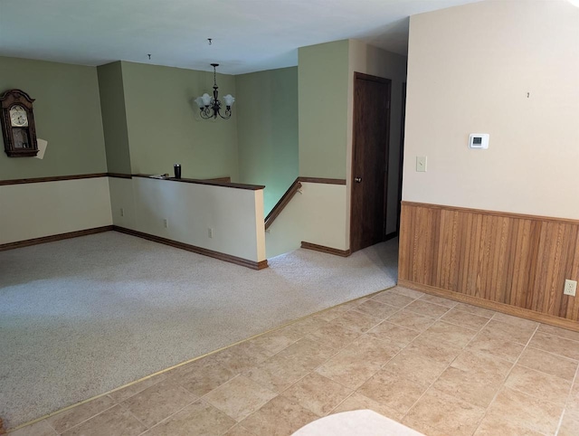 3664 Martin Rd, Kronenwetter, WI 54455 - empty room featuring a chandelier, a wainscoted wall, and wooden walls