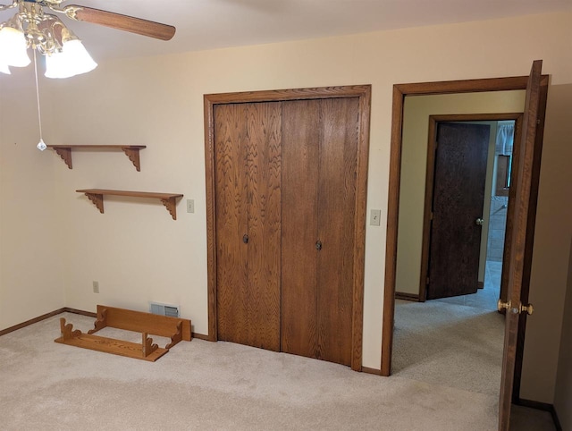 3664 Martin Rd, Kronenwetter, WI 54455 - unfurnished bedroom with carpet floors, a closet, and a ceiling fan