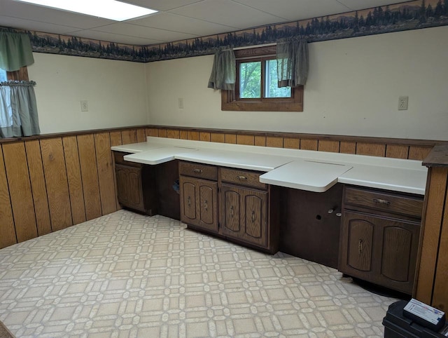 3664 Martin Rd, Kronenwetter, WI 54455 - kitchen with wainscoting, dark brown cabinets, and wood walls