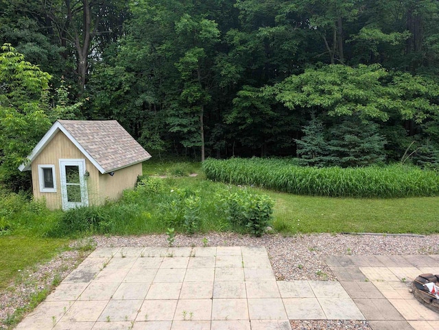 3664 Martin Rd, Kronenwetter, WI 54455 - view of patio / terrace with a storage shed and a view of trees