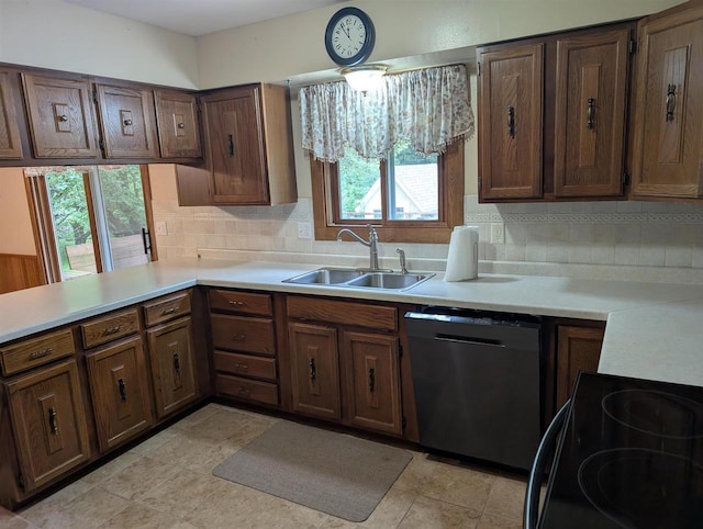 3664 Martin Rd, Kronenwetter, WI 54455 - kitchen featuring dishwashing machine, range with electric cooktop, light countertops, and decorative backsplash