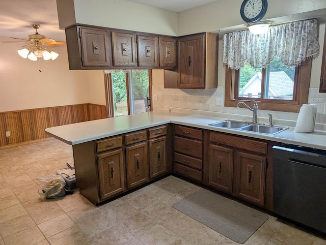 3664 Martin Rd, Kronenwetter, WI 54455 - kitchen with dishwashing machine, wainscoting, light countertops, plenty of natural light, and a peninsula