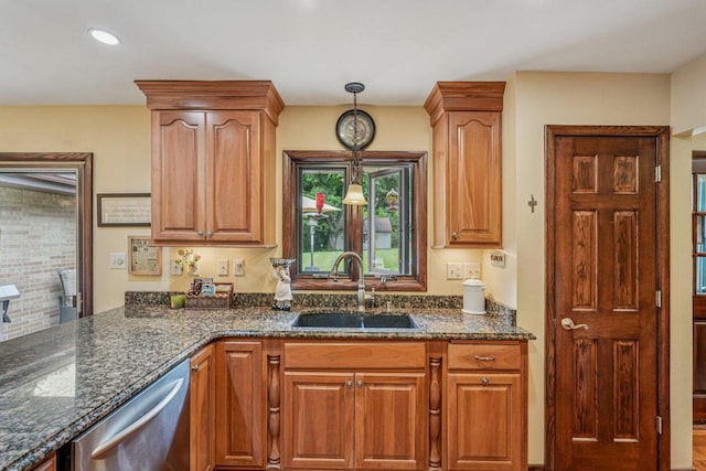 S46W22428 Tansdale Rd, Waukesha, WI 53189 - kitchen featuring dishwasher, dark stone counters, decorative light fixtures, and brown cabinets