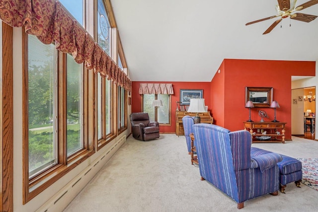 S46W22428 Tansdale Rd, Waukesha, WI 53189 - carpeted living area featuring a baseboard radiator, plenty of natural light, ceiling fan, and high vaulted ceiling