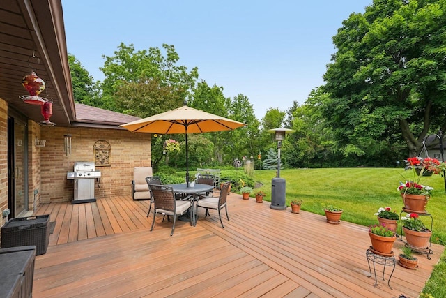S46W22428 Tansdale Rd, Waukesha, WI 53189 - deck with a grill, outdoor dining area, a yard, and view of wooded area