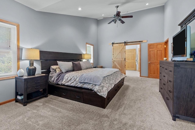 1201 Lance Dr, Twin Lakes, WI 53181 - bedroom with a barn door, light carpet, high vaulted ceiling, and recessed lighting