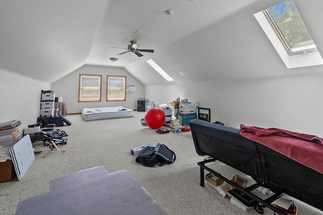 1201 Lance Dr, Twin Lakes, WI 53181 - rec room with a skylight, plenty of natural light, vaulted ceiling, carpet, and ceiling fan